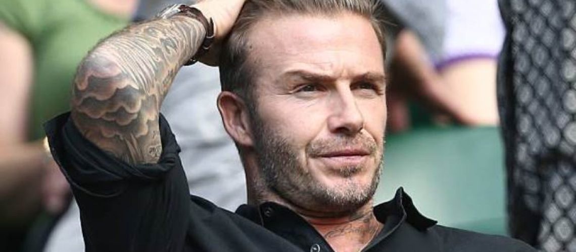 Former England footballer David Beckham watches Switzerland's Roger Federer's victory on centre court after he beat Croatia's Marin Cilic in their men's singles quarter-final match on the tenth day of the 2016 Wimbledon Championships at The All England Lawn Tennis Club in Wimbledon, southwest London, on July 6, 2016. / AFP / JUSTIN TALLIS / RESTRICTED TO EDITORIAL USE        (Photo credit should read JUSTIN TALLIS/AFP/Getty Images)