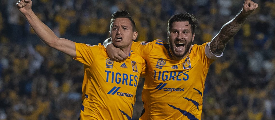 MONTERREY, MEXICO - DECEMBER 01: Florian Thauvin #26 of Tigres celebrates with teammate Andre-Pierre Gignac after scoring his team’s first goal  during the semifinal first leg match between Tigres UANL and Leon as part of the Torneo Grita Mexico A21 Liga MX at Universitario Stadium on December 01, 2021 in Monterrey, Mexico. (Photo by Azael Rodriguez/Getty Images)